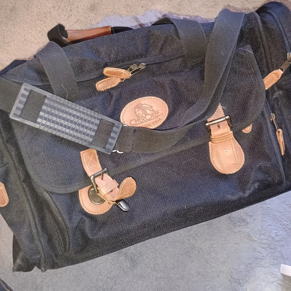 Never Used Cherokee Black and Tan Duffel Bag